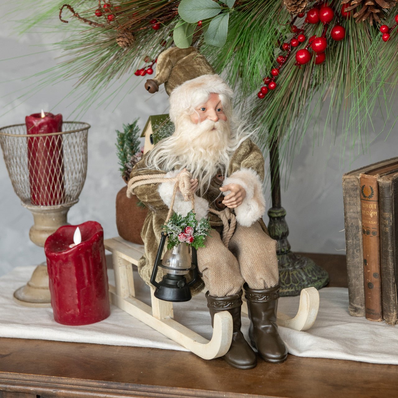Ragon House 13” Vintage Looking Santa on Sled w/ Olive Green Coat and Lantern - The Primitive Pineapple Collection