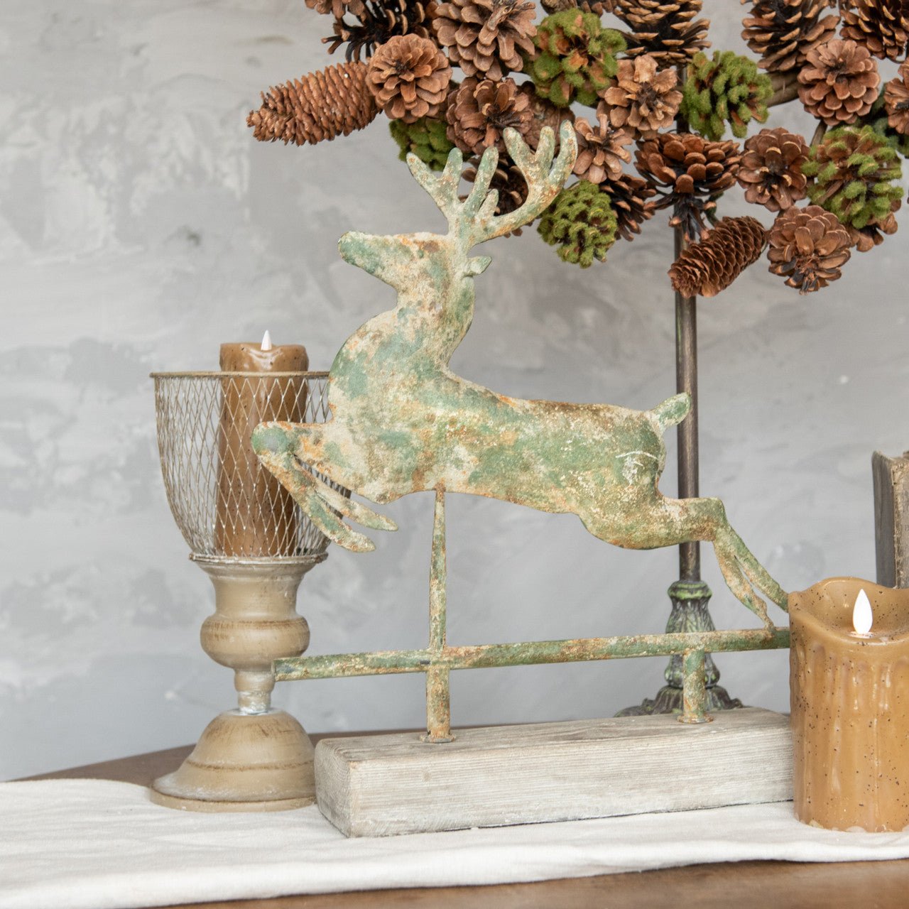 Primitive Ragon House Christmas Distressed Metal 15” Leaping Deer On Faux Wood Stand - The Primitive Pineapple Collection