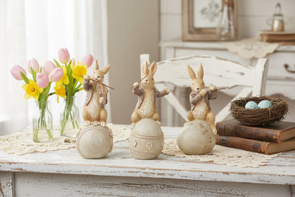 Farmhouse Spring Easter 8 Inch Brown Resin Musical Bunnies on Eggs 3 Designs - The Primitive Pineapple Collection