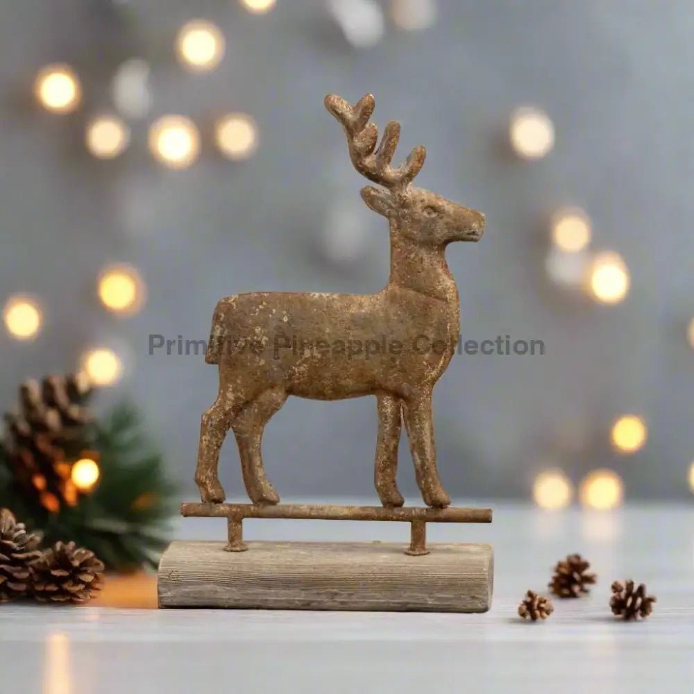 Ragon House 16" Primitive Distressed Metal Reindeer on Wood Base - The Primitive Pineapple Collection